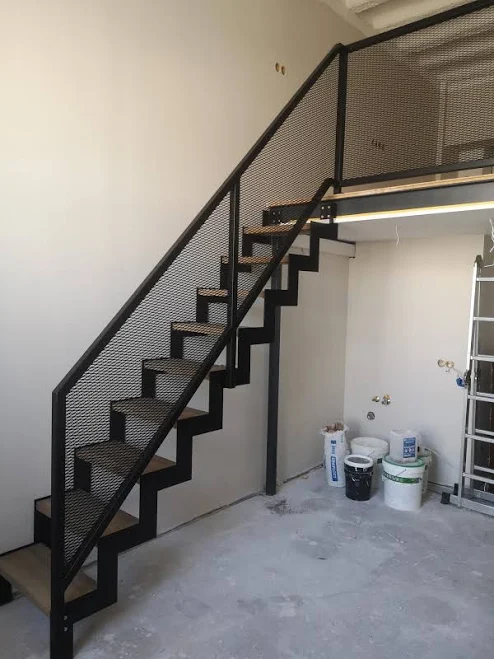Loft-style metal stairs with wooden s...