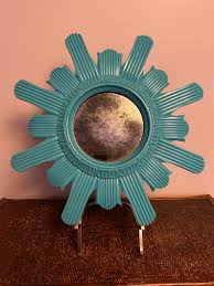 Teal sunburst mirror