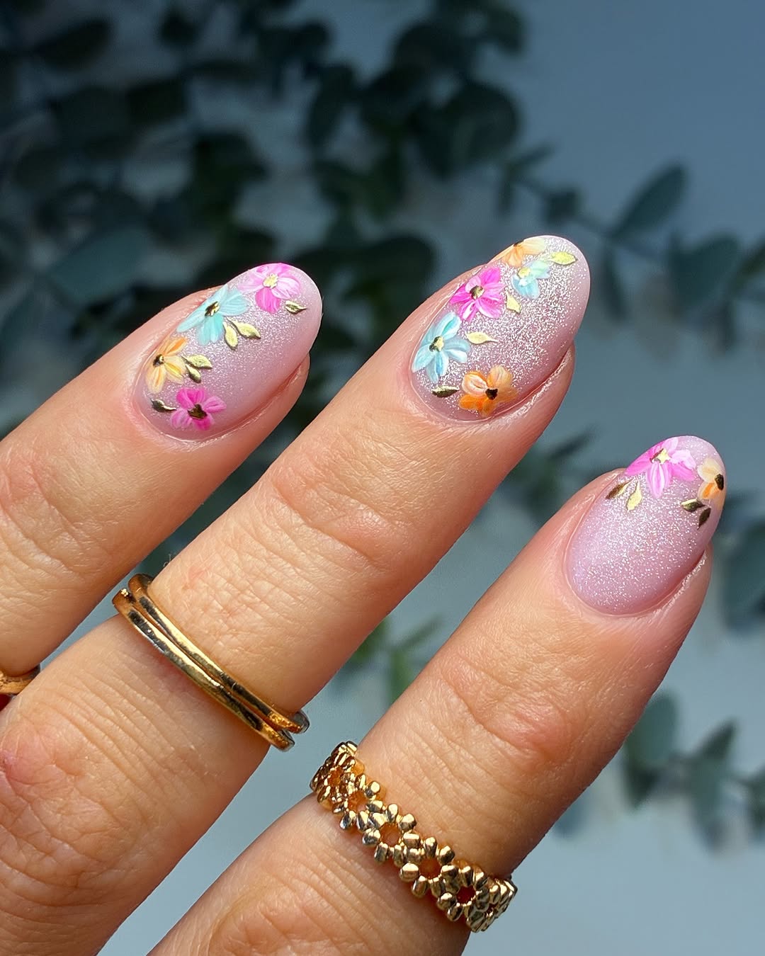 Dreamy Pink Glitter Oval Nails With Floral Accents