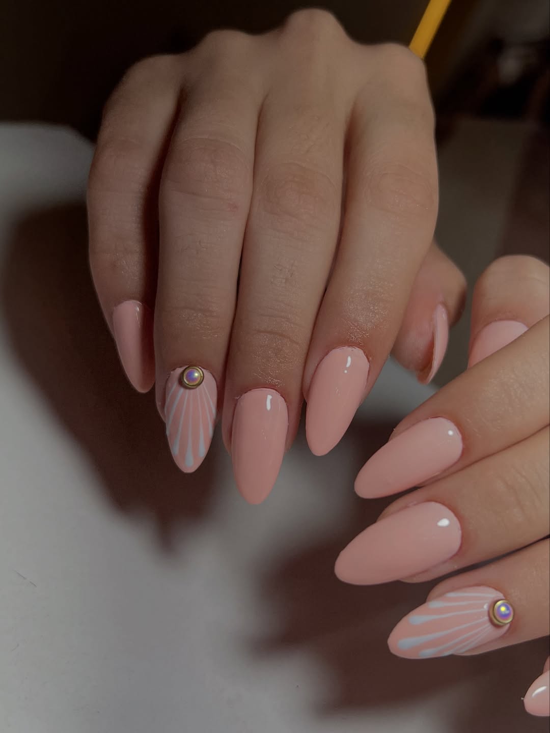 Soft Pink Almond Nails with Sunburst Art