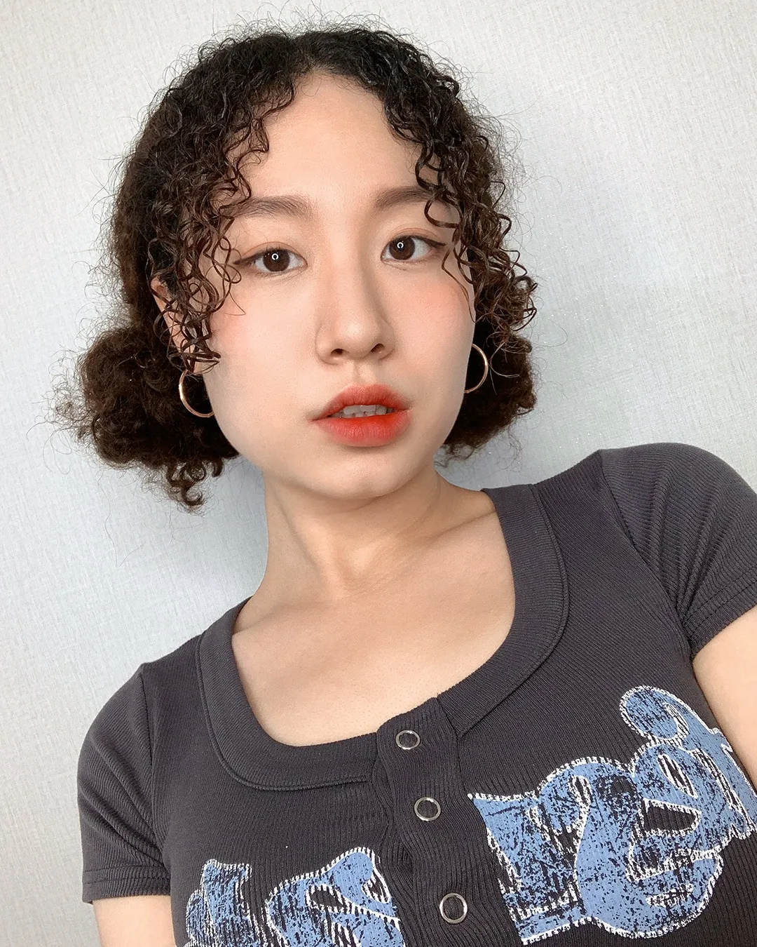 Chic Curly Updo With Face Framing Tendrils